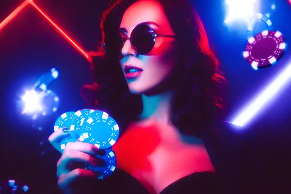 A player using their smartphone during a festive local event, representing JILI998’s fully mobile-friendly casino.